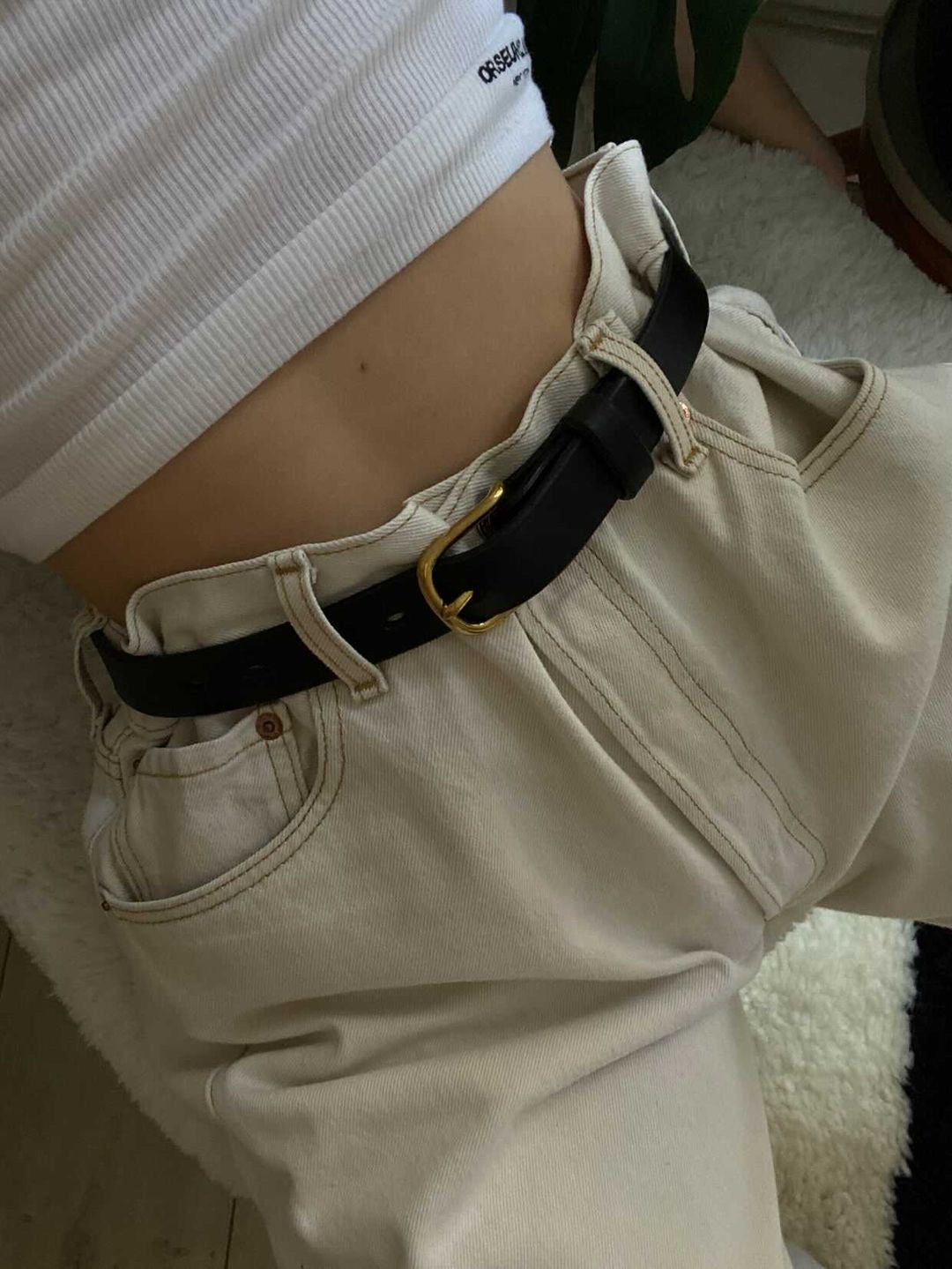 SAINT classic leather belt in black leather with solid brass buckle. made in Australia using traditional leather smith techniques. 100% Italian leather. worn by Christie Tyler
