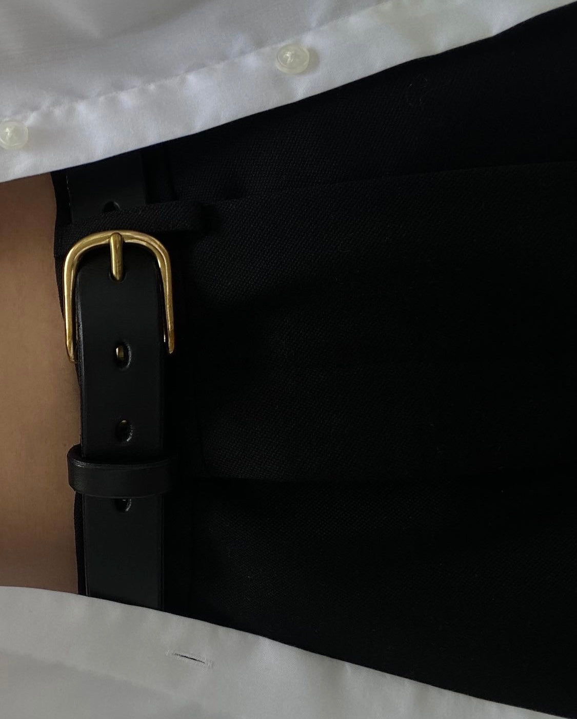 SAINT classic leather belt in black leather with solid brass buckle. made in Australia using traditional leather smith techniques. 100% Italian leather. worn by Emily Bonita